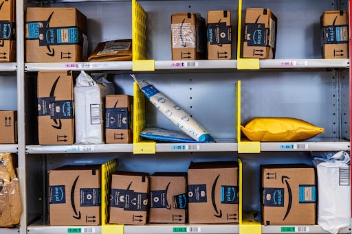 Amazon parcels on delivery shelves.